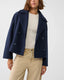 Navy cropped peacoat worn with wide leg trousers