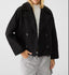 Black cropped peacoat worn with jeans