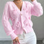 Women's Cable Knit Cardigan with Bow Details and Flared Cuffs