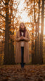 Woman in a camel wool coat on an autumn avenue