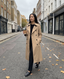 Woman wearing the Lauren Boutique double-breasted trench coat