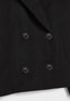 Detail of the buttons on the cream peacoat