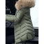 Army green parka worn with the hood up