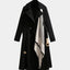 Black belted midi trench coat shown from the front