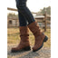 Brown biker boots worn with jeans