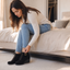 Black wedge ankle boots styled with cropped jeans