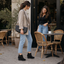 Wedge ankle boots worn on a city street