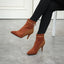 Vintage brown ankle boots worn with black leggings