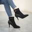 Classic black ankle boots worn with jeans