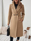 Camel wool blend coat worn with black trousers
