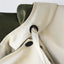 Detail of the covered button placket on the trench coat