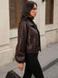 Cropped leather jacket seen from the side