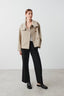 Beige cropped peacoat worn with black trousers