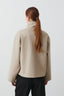 Back view of the beige cropped peacoat