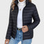 Black cropped puffer jacket worn with jeans