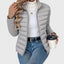 Sage green cropped puffer jacket worn open over a white top