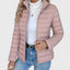 Pink cropped puffer jacket worn with jeans