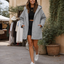 Puffer jacket worn with the hood down