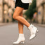 Women's double buckle pointed toe heeled boots in white