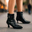 Women's double buckle pointed toe heeled boots in black