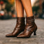 Women's double buckle pointed toe heeled boots in brown