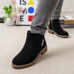 Women's faux shearling lined ankle boots in black