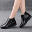 Black winter ankle boots worn on the foot