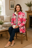 Floral print jacket worn with a scarf