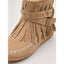 Buckled strap and fringe detail