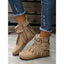 Beige moccasin boots worn on the foot