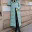 Sage green maxi puffer coat worn open
