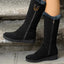 Black fur cuff boots worn on the street