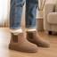 Tan fur lined winter boots worn with jeans
