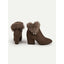 Detail of the faux fur collar on the brown boots
