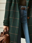 Green plaid coat worn open with jeans
