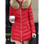 Red quilted parka worn with a coffee in hand