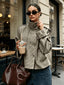 Houndstooth cropped jacket worn with jeans