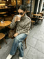 Houndstooth cropped jacket worn with wide leg jeans