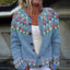 Close-up of the floral fair isle yoke on the dusty blue cardigan