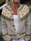 Close-up of the floral fair isle yoke on the oatmeal cardigan