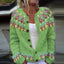 Close-up of the floral fair isle yoke on the sage green cardigan