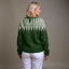 Back view of the forest green Icelandic knit cardigan