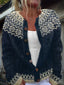 Close-up of the cream snowflake yoke on the navy cardigan