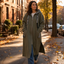 Longline hooded coat worn on a city street