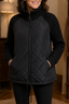 Women's knit panel quilted patchwork puffer jacket in black