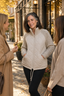 Panelled jacket worn outdoors