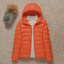 Women's lightweight packable puffer jacket in orange