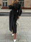 Black duster coat shown full length