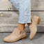 Khaki perforated ankle boots styled with cropped jeans