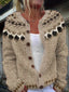 Close-up of the brown fair isle yoke on the oatmeal cardigan